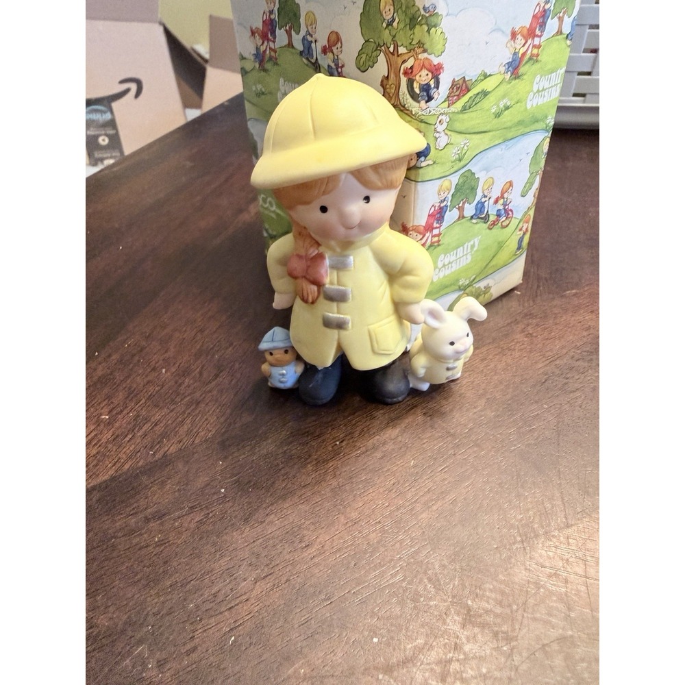Enesco Country Cousins Katie in raincoat 328383